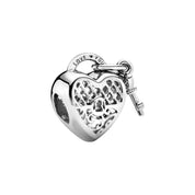 Precioso dije de plata de ley 925 para pulsera: corazón, corona y ojo malvado. Regalo.
